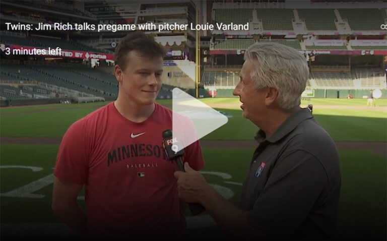 Jim Rich talks pregame with pitcher Louie Varland - NPG Sports
